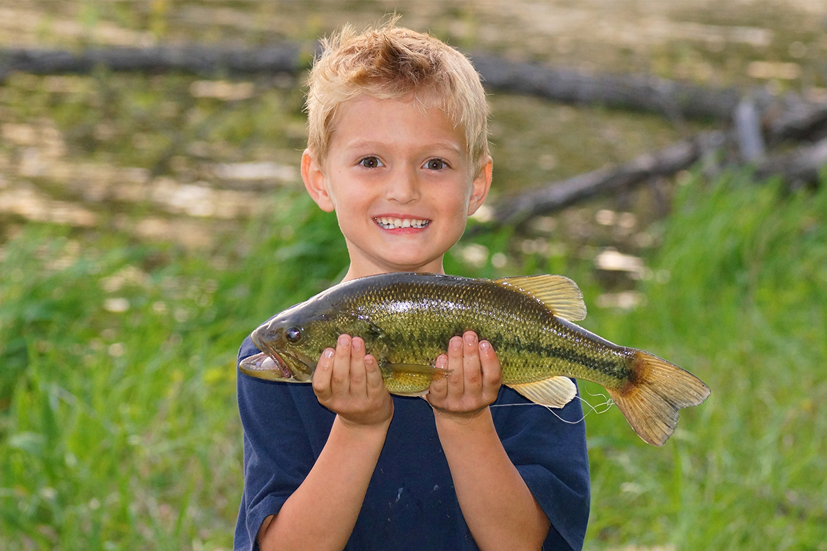 kid fishing for bass