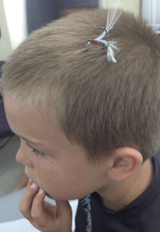 little boy with hook in his head